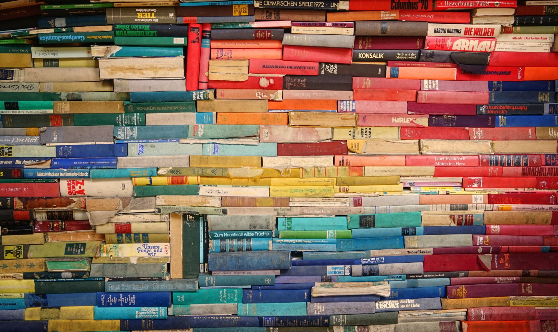 Colourful books stacked tightly